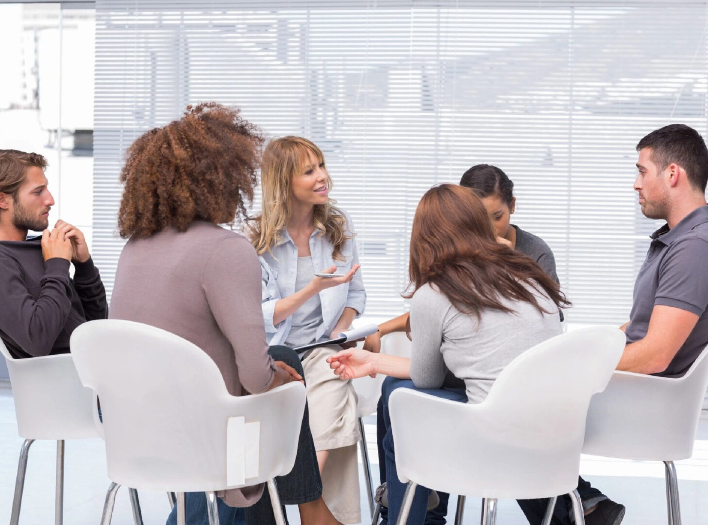A group of people sitting around a table.